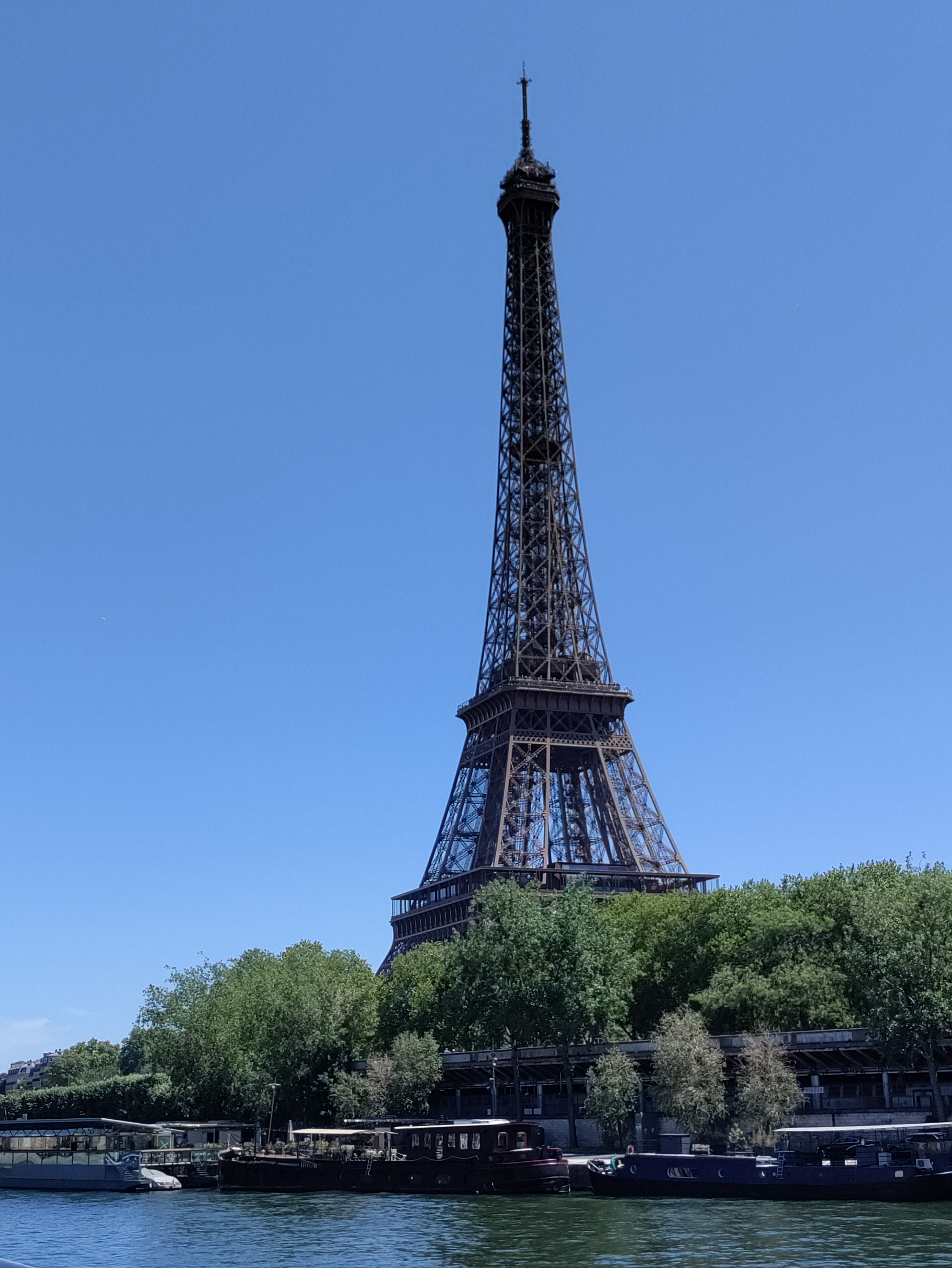 The Eiffel Tower as seen from a boat on the Seine River.