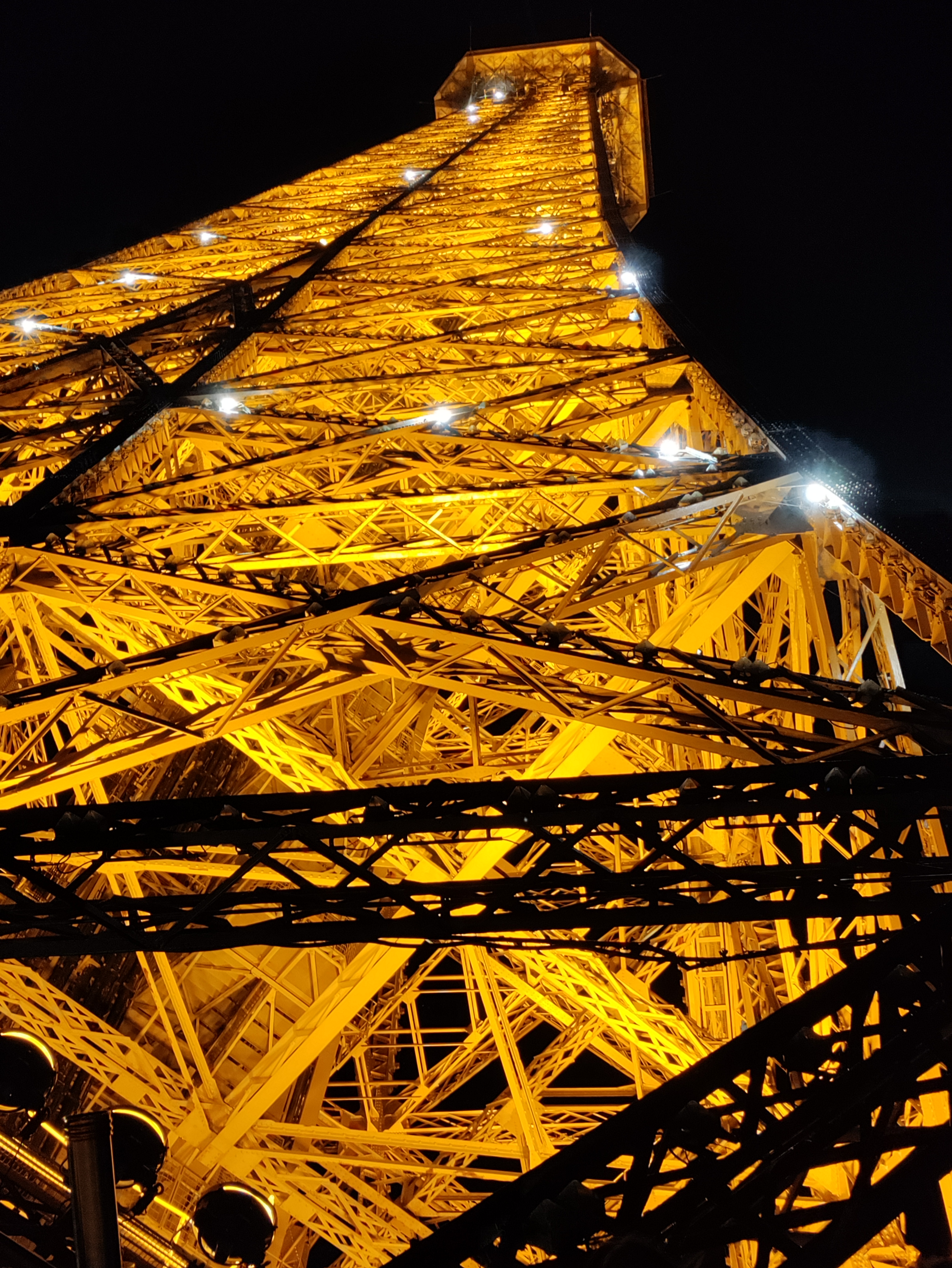 At night the Eiffel Tower and looks spectacular up close.